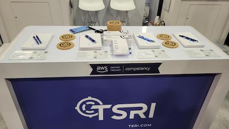 TSRI's re:Invent booth, including a few collectibles.